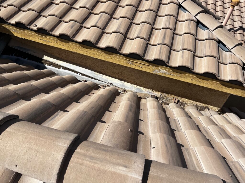 Tile roof repair in Las Vegas 89131 — roof tiles and wall flashing on Jalisco Avenue